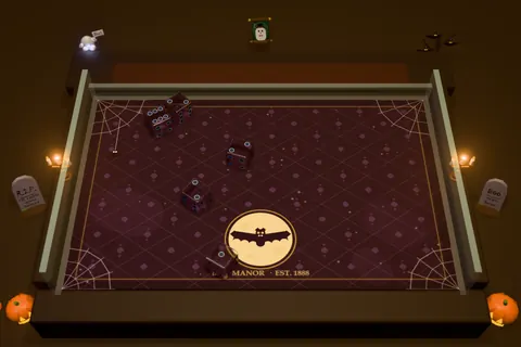 The Haunted Mansion table: a purple cobwebbed floor, a bat emblem, candles and pumpkins.